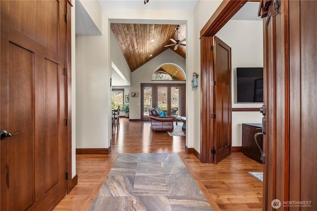 35 N Shore Dr, Orondo, WA 98843 - entrance foyer with a ceiling fan, wood ceiling, light wood-style flooring, baseboards, and high vaulted ceiling