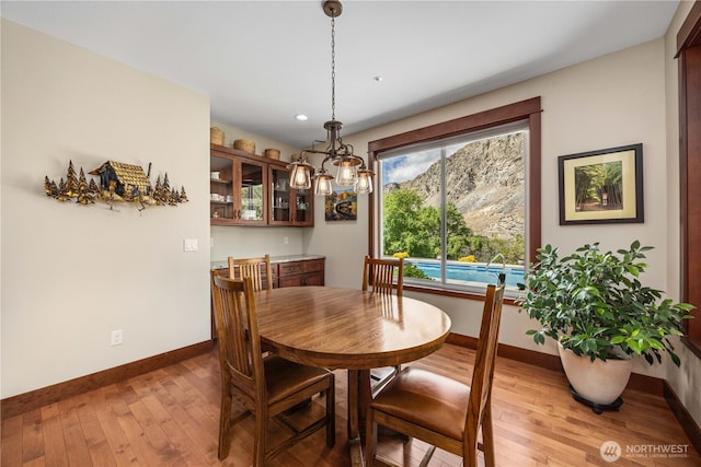 35 N Shore Dr, Orondo, WA 98843 - dining room featuring baseboards, light wood-type flooring, and recessed lighting