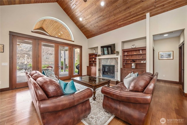 35 N Shore Dr, Orondo, WA 98843 - living room featuring plenty of natural light, wooden ceiling, a premium fireplace, baseboards, and light wood-style floors