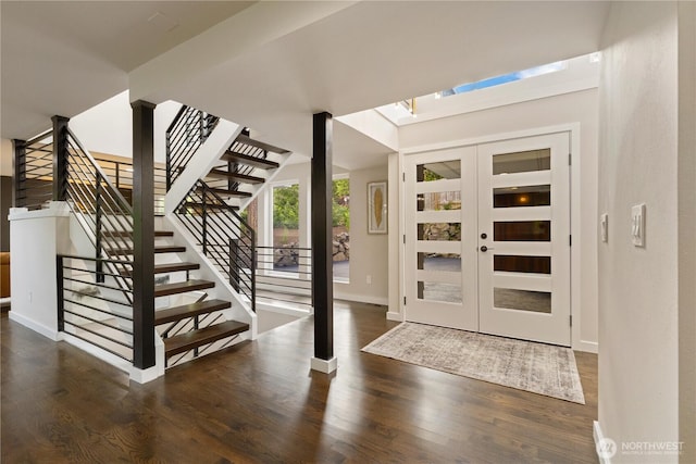 18510 NE 15th Pl, Bellevue, WA 98008 - foyer featuring wood finished floors, baseboards, stairs, and a skylight