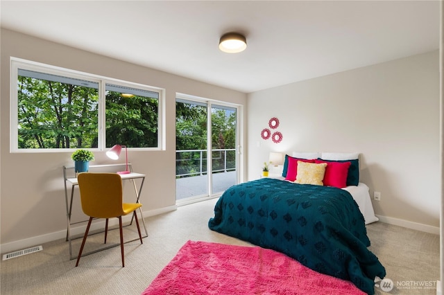 18510 NE 15th Pl, Bellevue, WA 98008 - carpeted bedroom featuring access to outside and baseboards