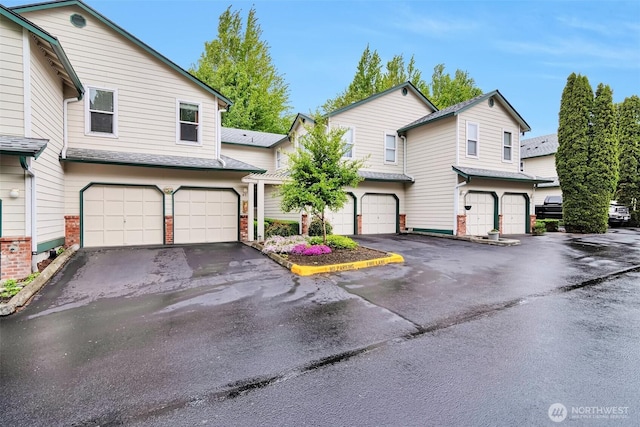 1131 115th St SW Unit M2, Everett, WA 98204 - view of property featuring an attached garage and driveway