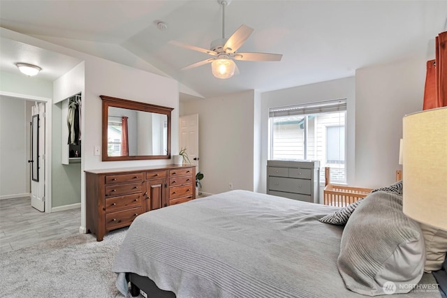 1131 115th St SW Unit M2, Everett, WA 98204 - bedroom with vaulted ceiling, baseboards, and a ceiling fan