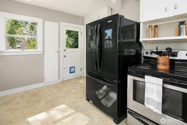 6813 17th Ave NE, Seattle, WA 98115 - kitchen featuring stainless steel electric stove, freestanding refrigerator, plenty of natural light, and white cabinets