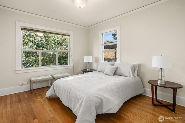 6813 17th Ave NE, Seattle, WA 98115 - bedroom with wood finished floors, baseboards, and crown molding