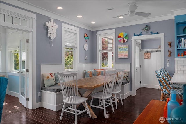 228 Meriweather St, Pacific Beach, WA 98571 - dining room with breakfast area, a wainscoted wall, wood finished floors, ornamental molding, and a ceiling fan