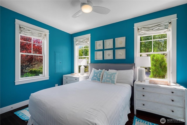 228 Meriweather St, Pacific Beach, WA 98571 - bedroom with wood finished floors, ceiling fan, and baseboards