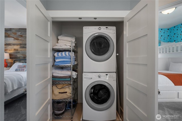 228 Meriweather St, Pacific Beach, WA 98571 - laundry room with stacked washer / drying machine and carpet flooring