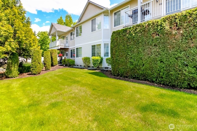 1002 9th Ave SE Unit C-201, Puyallup, WA 98372 - view of grassy yard featuring a balcony