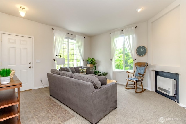 1002 9th Ave SE Unit C-201, Puyallup, WA 98372 - living area with plenty of natural light, baseboards, and a fireplace