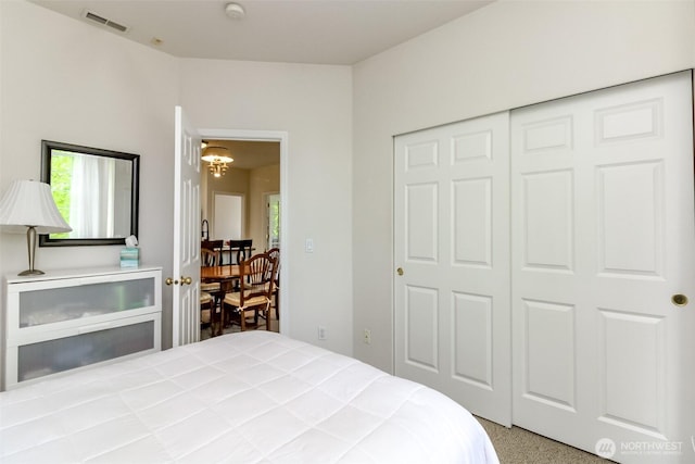 1002 9th Ave SE Unit C-201, Puyallup, WA 98372 - bedroom featuring a chandelier and a closet