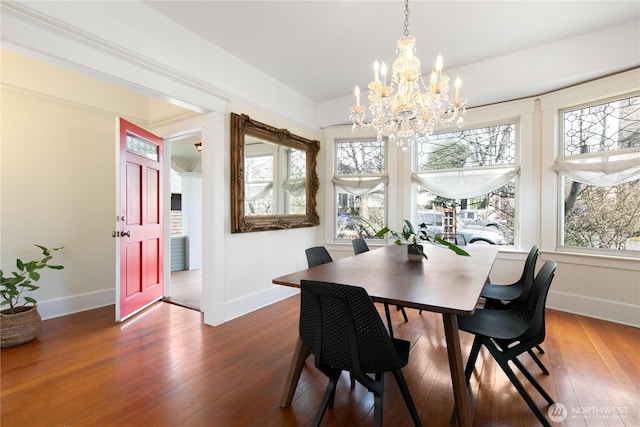 2011 E Cherry St, Seattle, WA 98122 - dining room with baseboards, a chandelier, and hardwood / wood-style floors