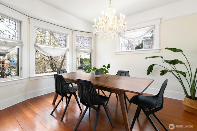 2011 E Cherry St, Seattle, WA 98122 - dining area featuring plenty of natural light, baseboards, and a chandelier
