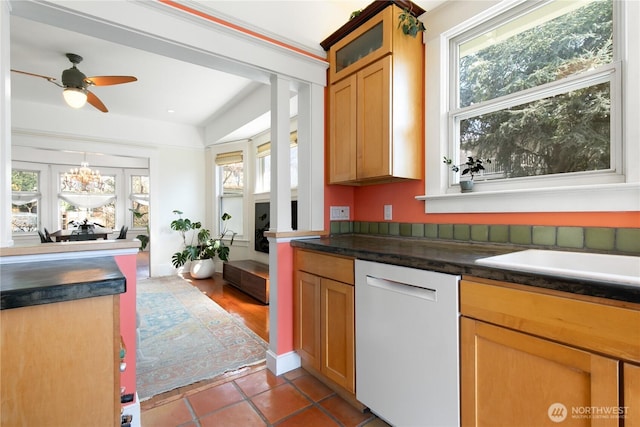 2011 E Cherry St, Seattle, WA 98122 - kitchen featuring white dishwasher, glass insert cabinets, ceiling fan, dark countertops, and tile patterned floors