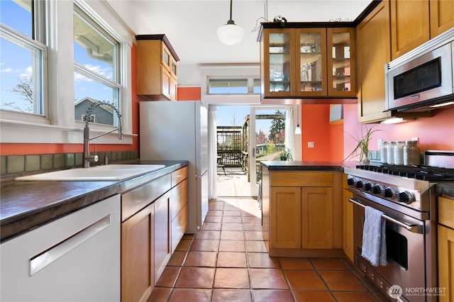 2011 E Cherry St, Seattle, WA 98122 - kitchen featuring stainless steel appliances, dark countertops, and plenty of natural light
