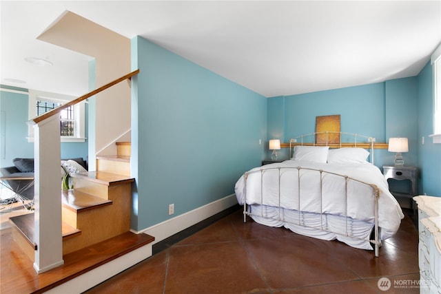 2011 E Cherry St, Seattle, WA 98122 - bedroom featuring multiple windows and baseboards