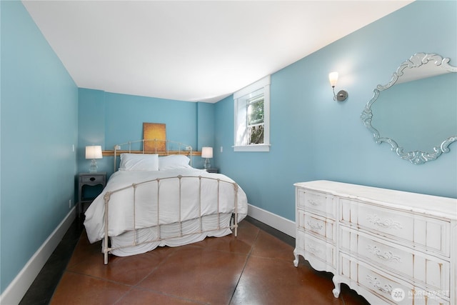 2011 E Cherry St, Seattle, WA 98122 - bedroom with baseboards and concrete floors