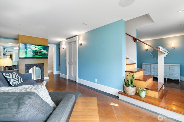 2011 E Cherry St, Seattle, WA 98122 - living room with stairs, tile patterned floors, and baseboards