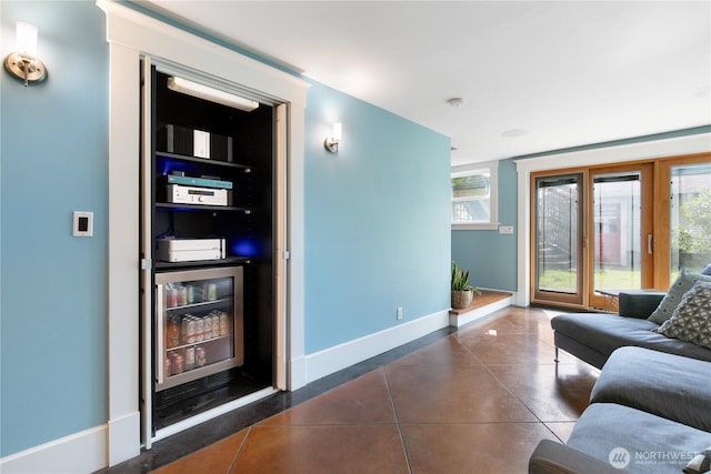 2011 E Cherry St, Seattle, WA 98122 - living room with wine cooler, baseboards, and tile patterned floors