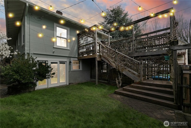 2011 E Cherry St, Seattle, WA 98122 - back of house featuring a wooden deck, a lawn, and stairway