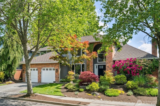 15102 93rd Pl NE, Bothell, WA 98011 - view of front of property featuring driveway, an attached garage, and brick siding