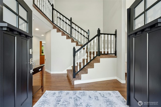 15102 93rd Pl NE, Bothell, WA 98011 - entryway with baseboards, wood finished floors, stairs, recessed lighting, and a towering ceiling