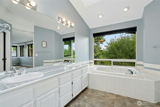 15102 93rd Pl NE, Bothell, WA 98011 - bathroom with a garden tub, double vanity, vaulted ceiling, and recessed lighting