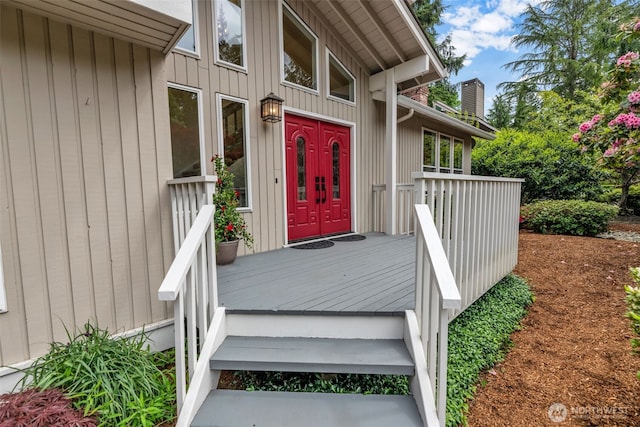 2714 Sahalee Dr E, Sammamish, WA 98074 - view of exterior entry with a chimney and a wooden deck