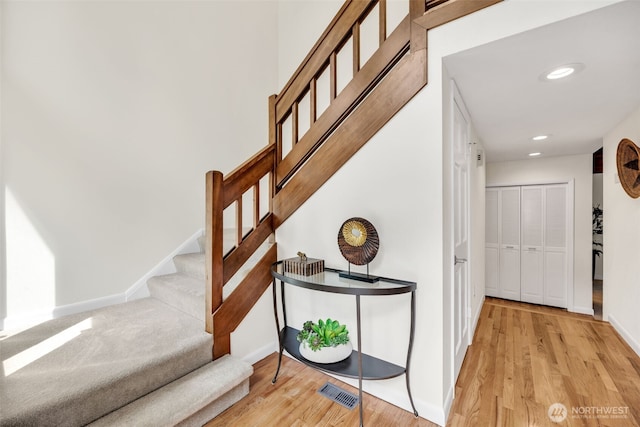 2714 Sahalee Dr E, Sammamish, WA 98074 - staircase with wood finished floors, baseboards, and recessed lighting