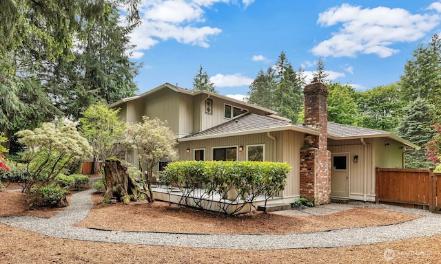 2714 Sahalee Dr E, Sammamish, WA 98074 - view of front facade with a shingled roof and a chimney