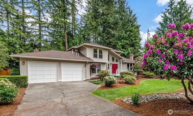 2714 Sahalee Dr E, Sammamish, WA 98074 - view of front of house featuring a chimney, a garage, driveway, and a front yard
