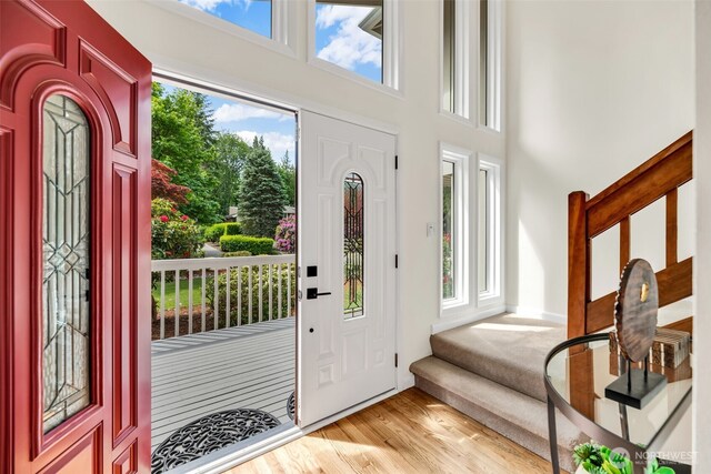 2714 Sahalee Dr E, Sammamish, WA 98074 - entryway featuring stairs, light wood-style flooring, and a high ceiling