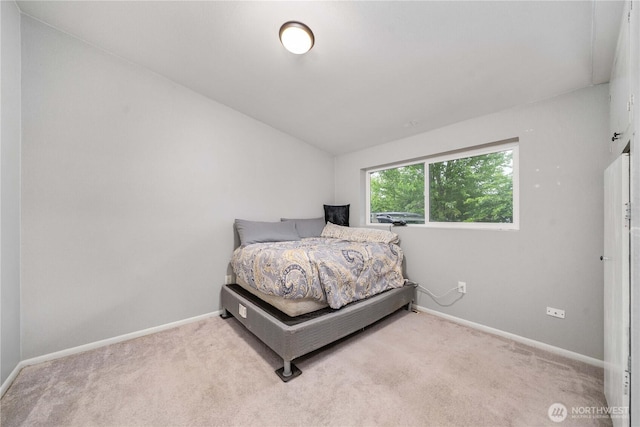 8909 Hipkins Rd SW, Lakewood, WA 98498 - carpeted bedroom with baseboards and lofted ceiling