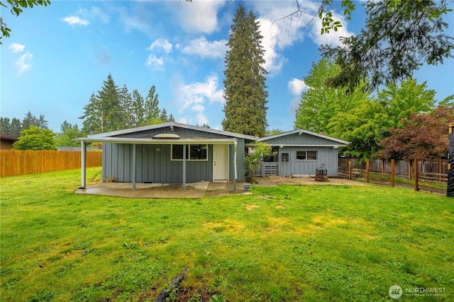 8909 Hipkins Rd SW, Lakewood, WA 98498 - back of house with board and batten siding and a patio