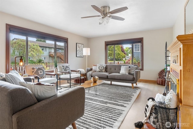 1001 Elm St, Centralia, WA 98531 - living room with ceiling fan, wood finished floors, and baseboards