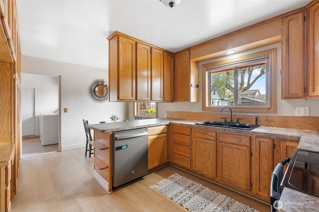 1001 Elm St, Centralia, WA 98531 - kitchen with dishwasher, a sink, light wood-style flooring, and healthy amount of natural light