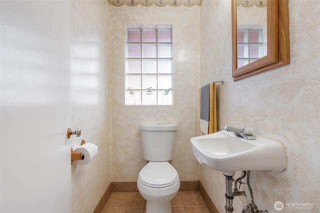 1001 Elm St, Centralia, WA 98531 - bathroom featuring toilet, tile patterned floors, and baseboards
