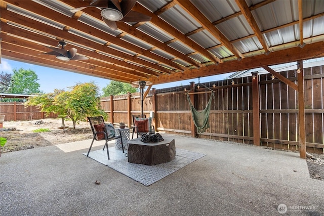 1001 Elm St, Centralia, WA 98531 - fenced backyard with ceiling fan and a patio area