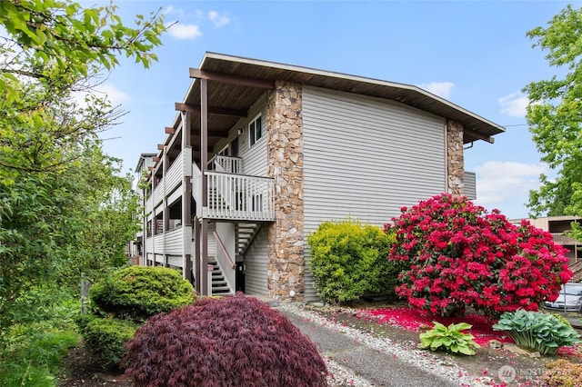 315 10th Ave S Unit 101, Kirkland, WA 98033 - view of side of home with stone siding and stairs