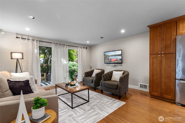 315 10th Ave S Unit 101, Kirkland, WA 98033 - living room with light wood-style flooring, recessed lighting, and baseboards