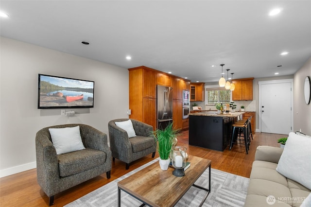 315 10th Ave S Unit 101, Kirkland, WA 98033 - living room with recessed lighting, light wood-style flooring, and baseboards