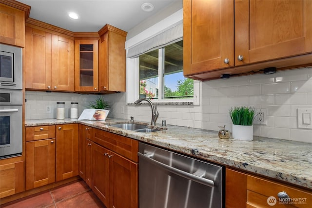 315 10th Ave S Unit 101, Kirkland, WA 98033 - kitchen featuring stainless steel appliances, a sink, brown cabinets, and recessed lighting