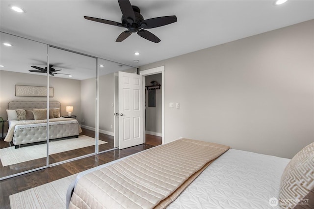 315 10th Ave S Unit 101, Kirkland, WA 98033 - bedroom with wood finished floors, recessed lighting, baseboards, a closet, and a ceiling fan