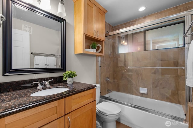 315 10th Ave S Unit 101, Kirkland, WA 98033 - full bath with toilet, vanity, combined bath / shower with glass door, and recessed lighting