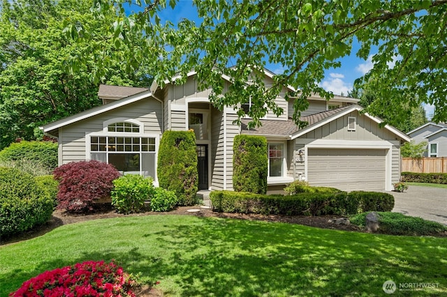32910 NE 40th Pl, Carnation, WA 98014 - view of front facade featuring an attached garage, driveway, a front yard, and board and batten siding