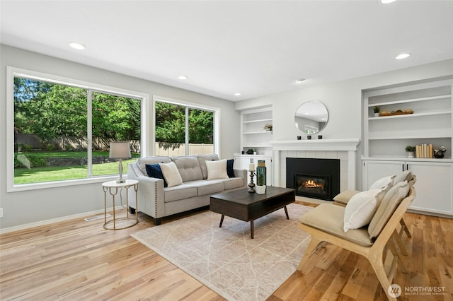 32910 NE 40th Pl, Carnation, WA 98014 - living area with plenty of natural light, a fireplace, baseboards, built in features, and recessed lighting