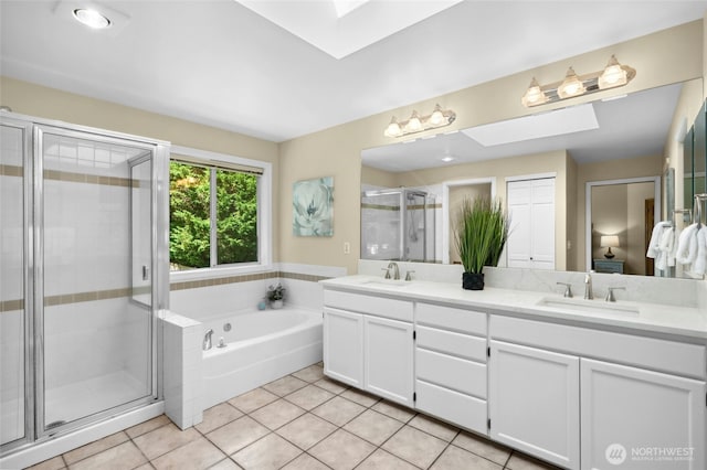 32910 NE 40th Pl, Carnation, WA 98014 - full bathroom featuring a skylight, double vanity, tile patterned floors, a garden tub, and a stall shower