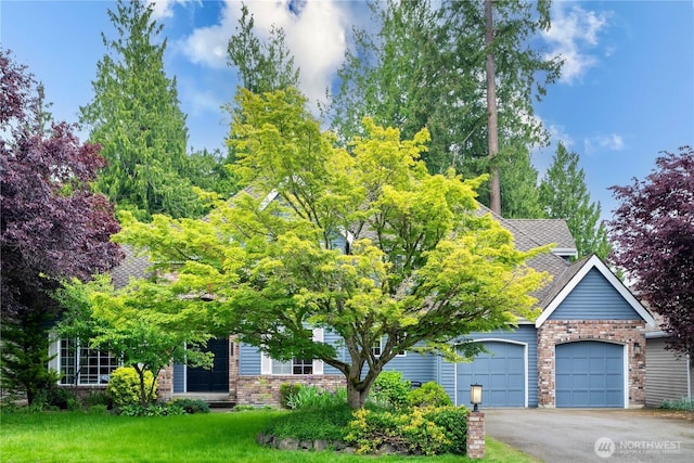2110 216th Pl NE, Sammamish, WA 98074 - view of property hidden behind natural elements with a garage, brick siding, asphalt driveway, a shingled roof, and a front lawn