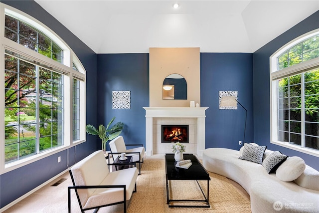 2110 216th Pl NE, Sammamish, WA 98074 - carpeted living area featuring lofted ceiling, healthy amount of natural light, a tiled fireplace, and baseboards