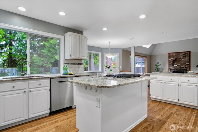 2110 216th Pl NE, Sammamish, WA 98074 - kitchen featuring appliances with stainless steel finishes, a sink, plenty of natural light, white cabinetry, and recessed lighting